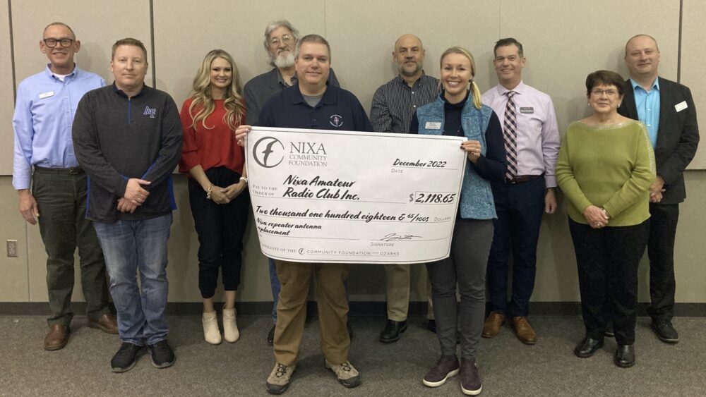 Check is presented at a Nixa grant presentation