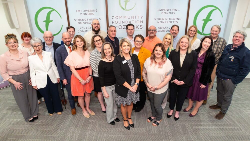 A group of people representing donors and nonprofits celebrate grants presented by the Community Foundation of the Ozarks.