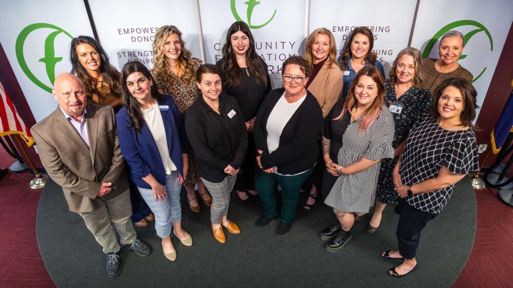 A group of people representing schools, school foundations and nonprofits celebrate grants presented by the Community Foundation of the Ozarks and the Coover Charitable Foundation.