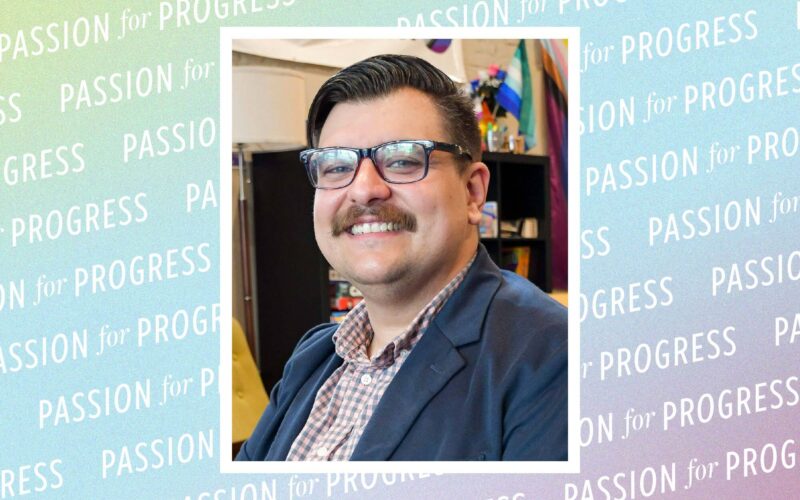 Portrait of Aaron Kitchens, a man wearing glasses and a blazer. Behind the portrait, Passion for Progress is repeated on a multicolored background.