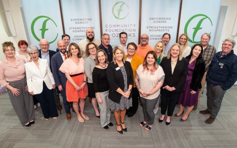 A group of people representing donors and nonprofits celebrate grants presented by the Community Foundation of the Ozarks.