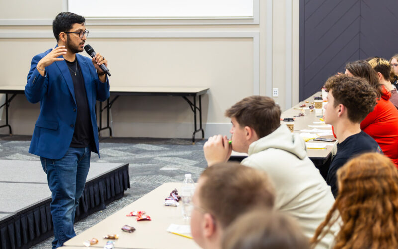 Dr. Marcos Silva speaks to a crowd of high school students.