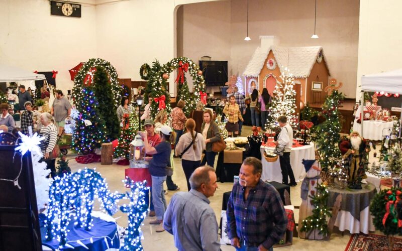 Holiday decorations fill a gymnasium for a Christmas bazaar in Thomasville, Missouri.