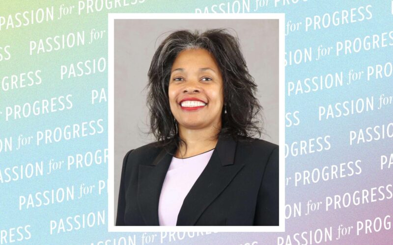 A multicolored background with a repeating pattern that reads Passion for Progress with a photo in the center. The photo is a portrait of a woman, smiling and wearing a dark-colored jacket.