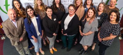 A group of people representing schools, school foundations and nonprofits celebrate grants presented by the Community Foundation of the Ozarks and the Coover Charitable Foundation.